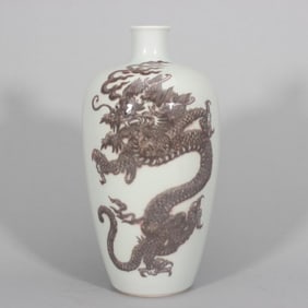 A red dragon pattern plum vase in the Qing Kangxi glaze