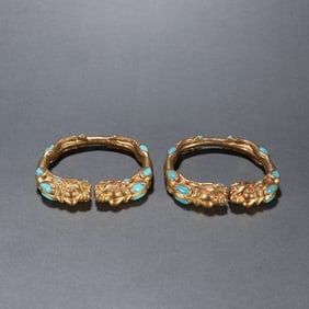 A pair of Qing copper gilt turquoise bracelets
