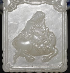 A white jade carving of the Qing Dynasty Lao Tzu riding a bull brand Taoist masterpiece