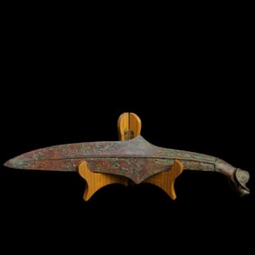 A Warring States bronze sheep's head knife