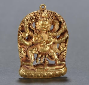 A copper-gilt six-armed Mahakala pendant