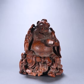 A Qing Dynasty bamboo carved bell and Kui ornament