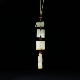 A jade Han Dynasty evil warding four treasure pendant