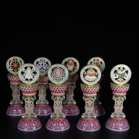 A set of pastel carved lotus petal pattern eight treasure ornaments made in the Qianlong period of