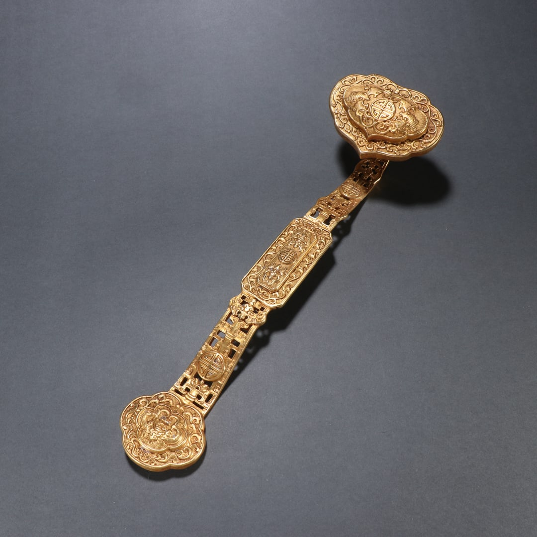 A copper gilt blessing is in front of the wishful handle (1 of 9)