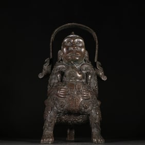 A Western Zhou bronze ape man lifting the beam