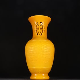 A clear chanterelle yellow material vessel braided pattern longevity bottle