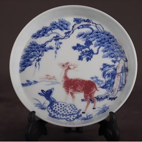 A Qing Qianlong blue and white glazed red double deer plate