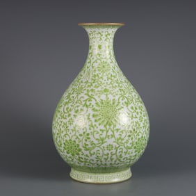 A green passionflower longevity pattern jade pot spring vase made in the Qianlong period of the Qing