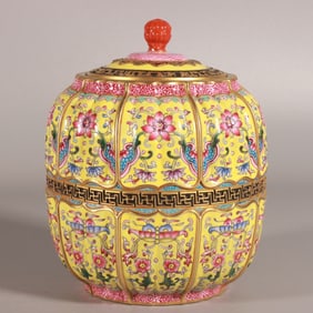 A Qing Qianlong enamel yellow ground entangled lotus melon and water chestnut tea jar