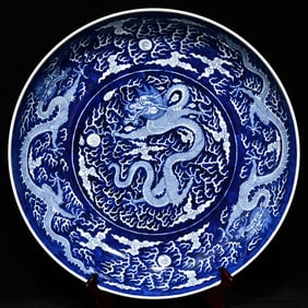 A blue and white five-dragon plate of the Qing Dynasty Palace