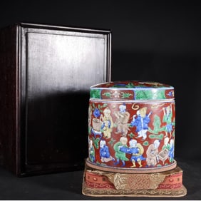 A Ming Dynasty Wanli blue and white red ground baby play jar