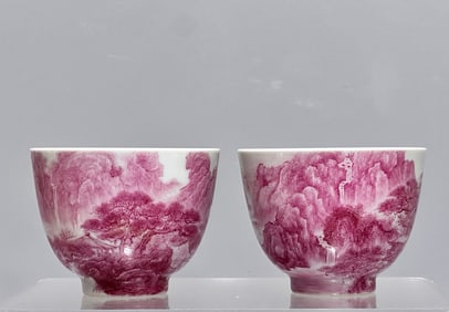 A pair of carmine red landscape cups made in the Yongzheng era of the Qing Dynasty