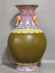 A Qing Dynasty Qianlong tea jasmine green elephant ear bottle