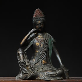 A bronze gold statue of Guanyin