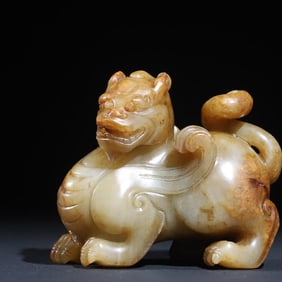 A jade carved winged beast ornament of the Qing Dynasty to ward off evil spirits