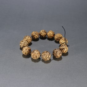 A copper gilt dragon pattern bracelet
