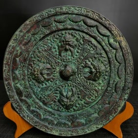 A bronze animal head mirror