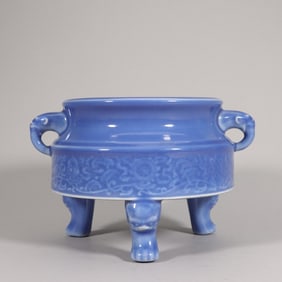 A Qing Yongzheng sky blue glaze carved entwined eight treasure pattern amphora three-legged furnace