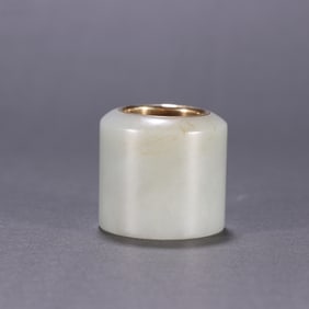 A piece of Hetian jade covered with gold fingers