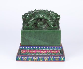 A late Qing Dynasty Hetian jasper crossed over the dragon button and a large seal