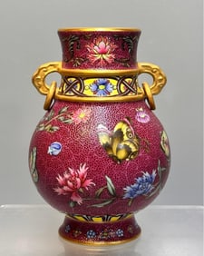 A Qianlong era enamel painted butterfly love flower vase