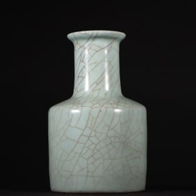 A Song Dynasty official kiln powder celadon paper hammer bottle
