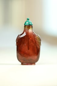 A tourmaline beast head ring snuff bottle