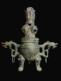 A Warring States bronze double dragon incense cauldron