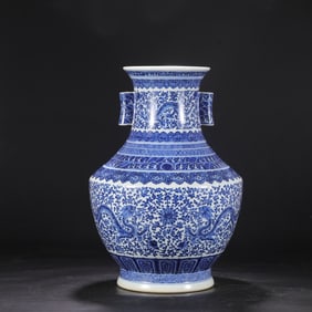 A Qing Dynasty Qianlong blue and white entwined dragon pattern piercing ear vase