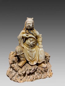 A seated statue of Guan Gong in Shoushan stone carving in the Qing Dynasty