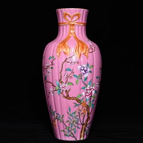 A Qing Qianlong peach red ground rolling road pastel floral ribbon melon edge bottle