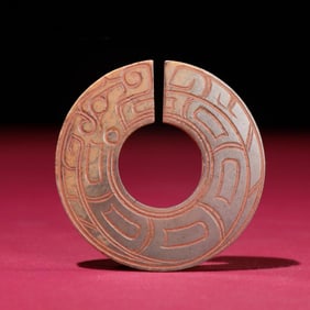 A jade dragon pendant of the Han Dynasty
