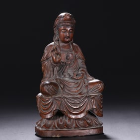 A boxwood carved seated statue of Guanyin
