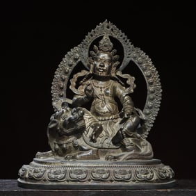A bronze gold statue of the King of Treasures