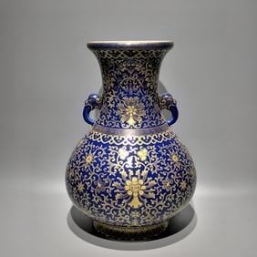 A Qing Qianlong model sacrificial blue glaze gold-painted treasure flower dragon ear curled pipa