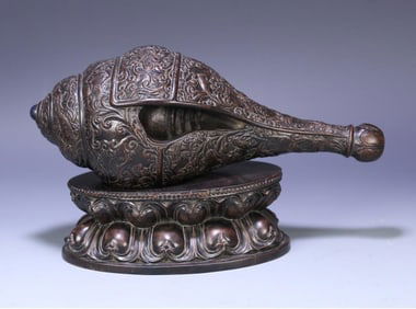 A late Qing Dynasty old agarwood dark eight immortals beast pattern conch ornament