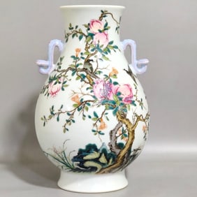 A Qing Qianlong pastel flower and bird ruyi binaural statue