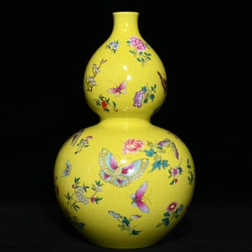 A Qing Qianlong yellow pastel flower butterfly gourd bottle