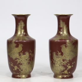 A pair of cowpea red gold-painted flower and bird poetry vases made in the Qianlong period of the