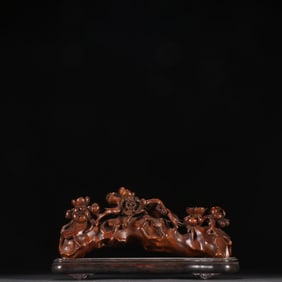 A Qing boxwood plum pattern ornament