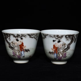 A pair of Qing Qianlong pastel baby play picture cups