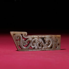 A Han Dynasty hollow carved dragon jade sword ornament