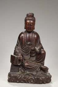 A Qing Dynasty mahogany carved scroll Guanyin ornament