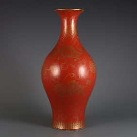 A coral red background gold-painted lion ball olive bottle made in the Yongzheng era of the Qing