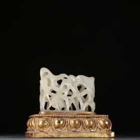 A silver-gilt jade ornament