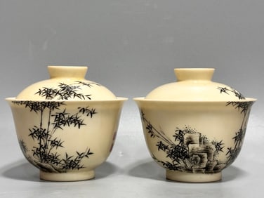 A pair of Qianlong year beige ink landscape bowls