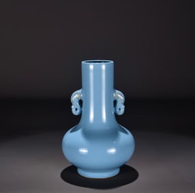 A Qing Qianlong sky blue glaze gold-painted elephant ear bottle