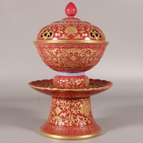 A Qing Qianlong pastel carmine carved gold-painted gaiwan