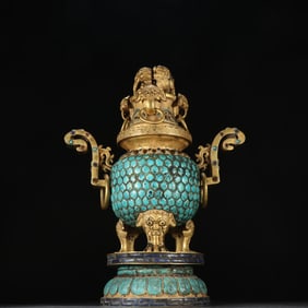 A piece of Qing copper gilt inlaid turquoise beast foot towards the crown ear double lion incense